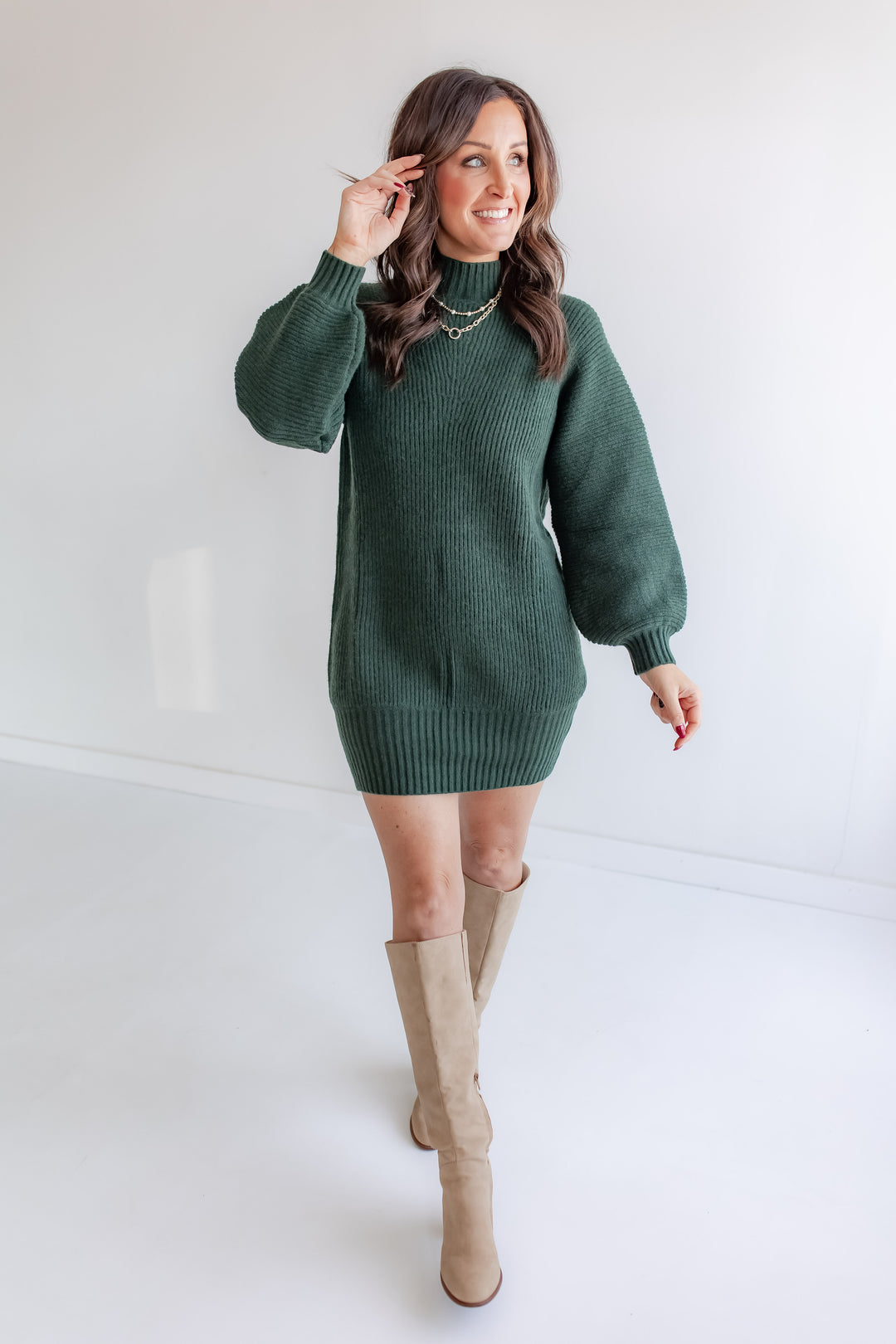 Cozy winter turtleneck knit dress with tall boots