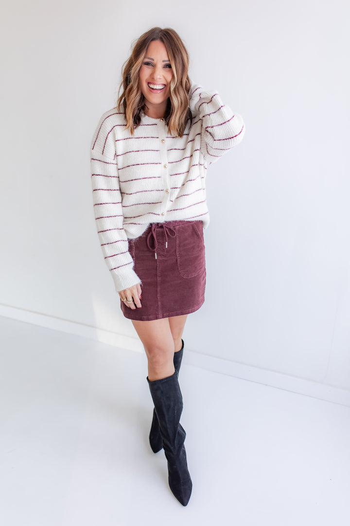 Fall outfit with striped mohair cardigan paired with a wine corded skirt.