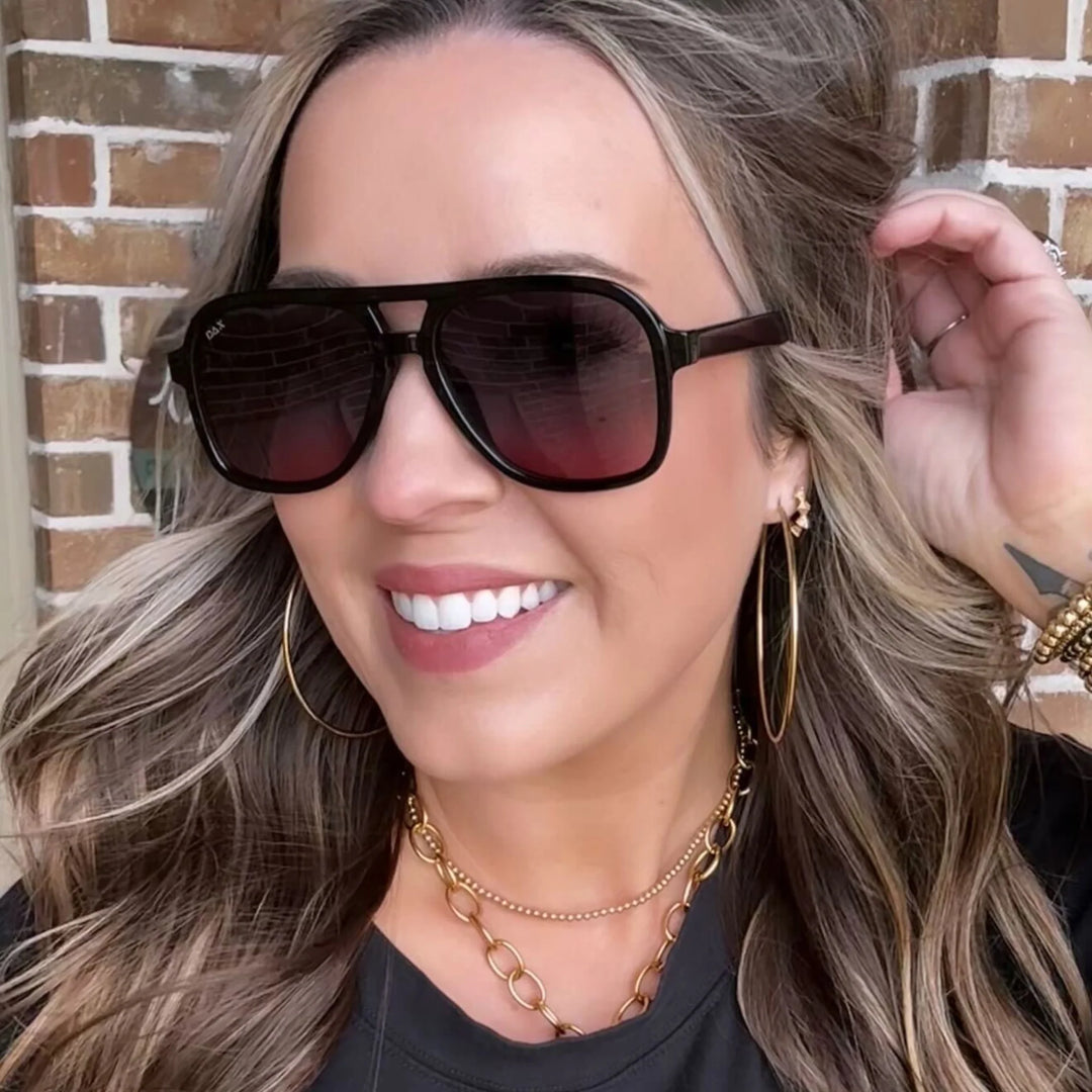 Woman wearing the Cruz sunglasses in smokeshow