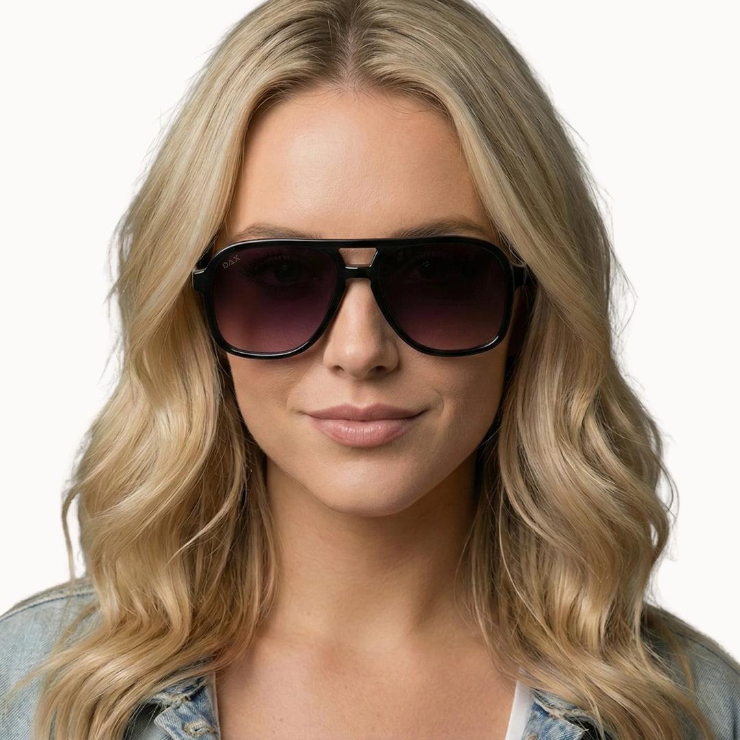 Woman wearing the Cruz smokeshow sunglasses with a neutral background