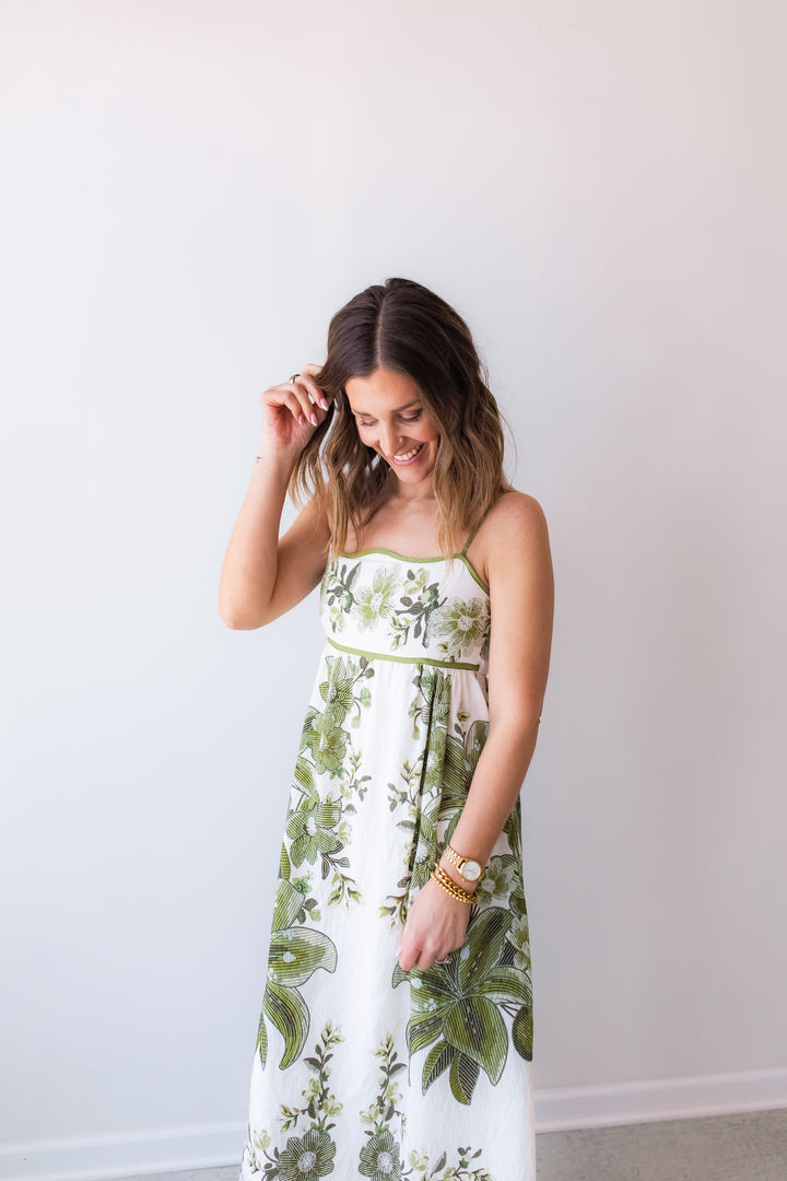 midi dress with green floral details for vacations and weddings