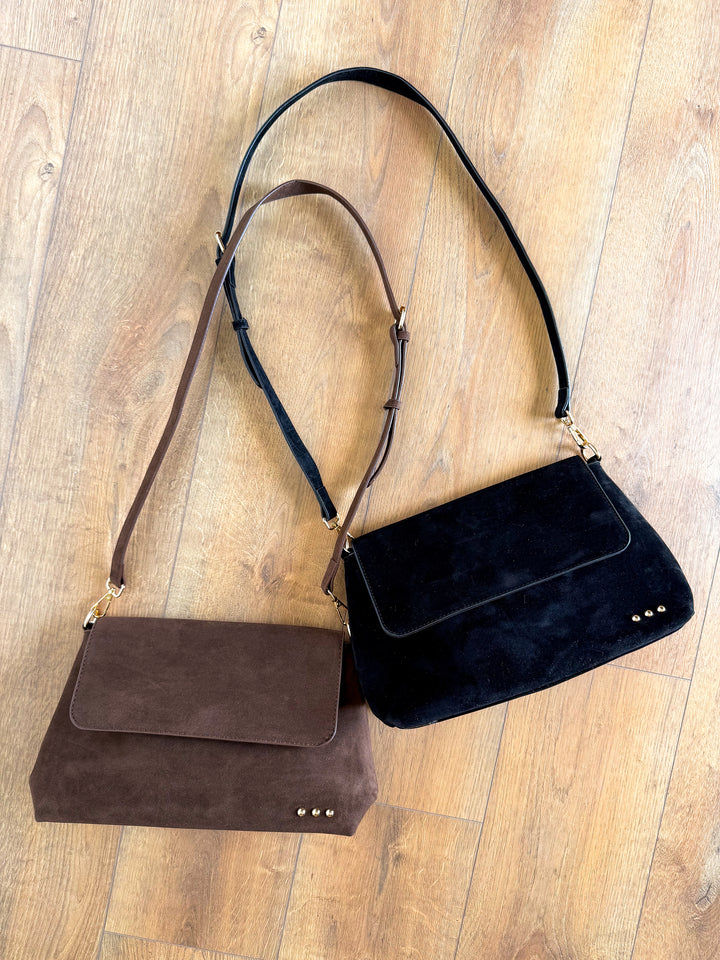 Chocolate brown and black suede crossbody bags with magnetic flap closure and gold stud detail