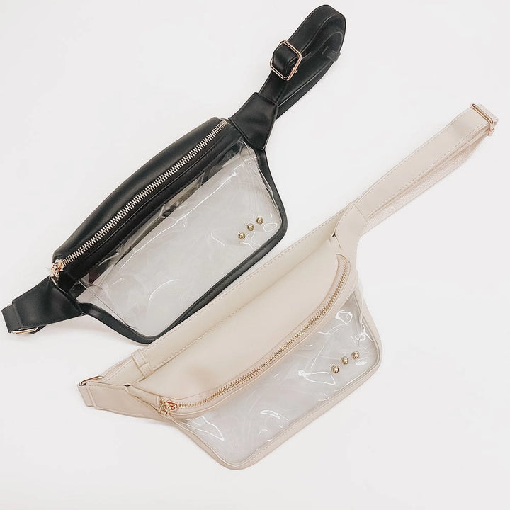 Clear stadium belt bags in black and cream faux leather trim with gold zipper hardware and adjustable straps