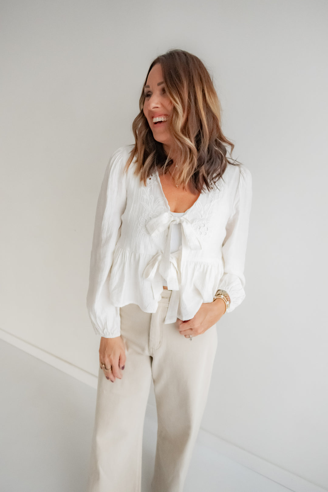 Cream eyelet blouse with tie front for women