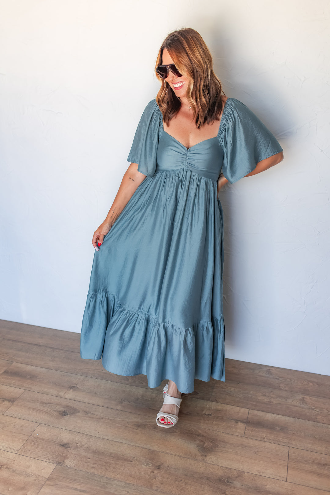 dusty blue midi dress with flowy sleeves