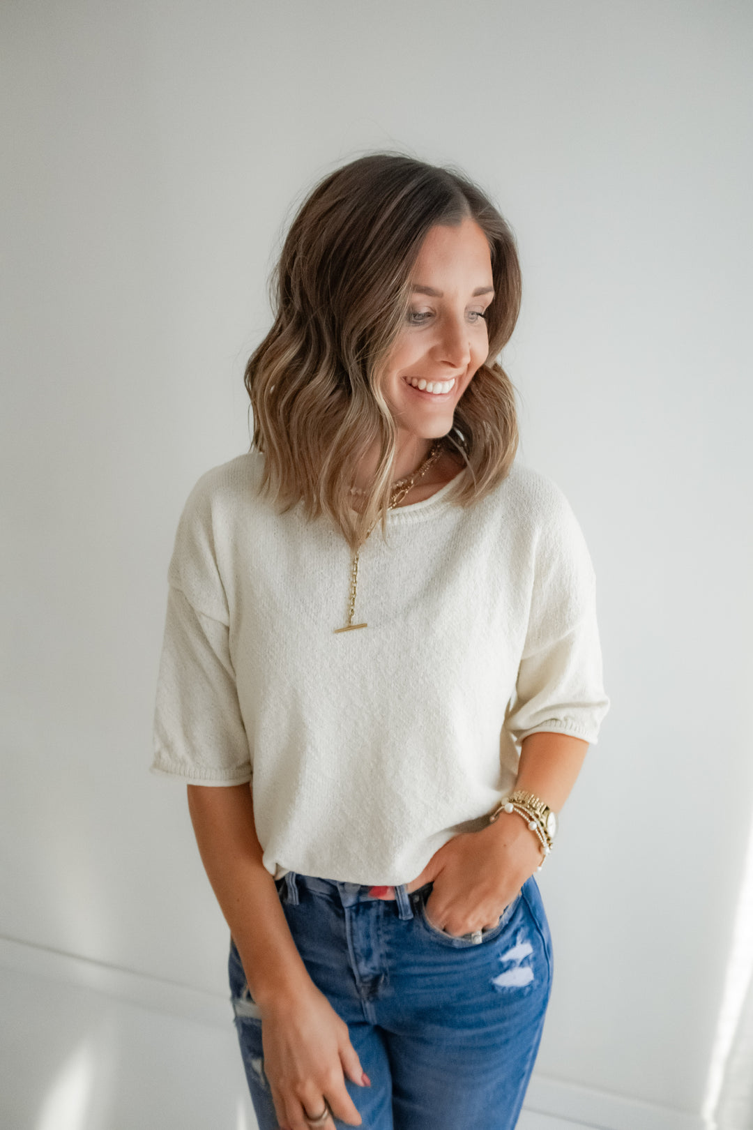 Ivory textured knit top with longer short sleeves