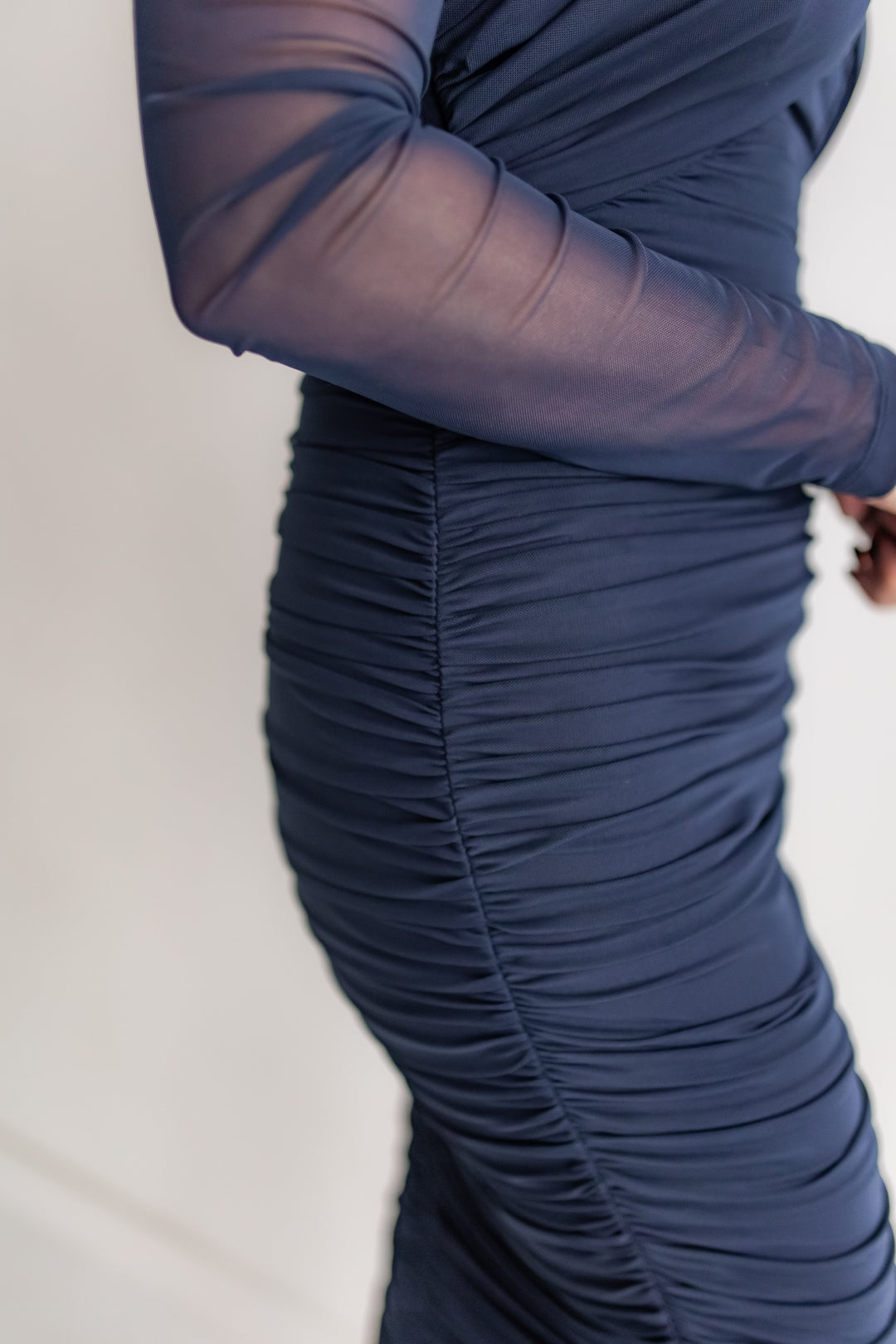 Women’s navy dress with sheer sleeves