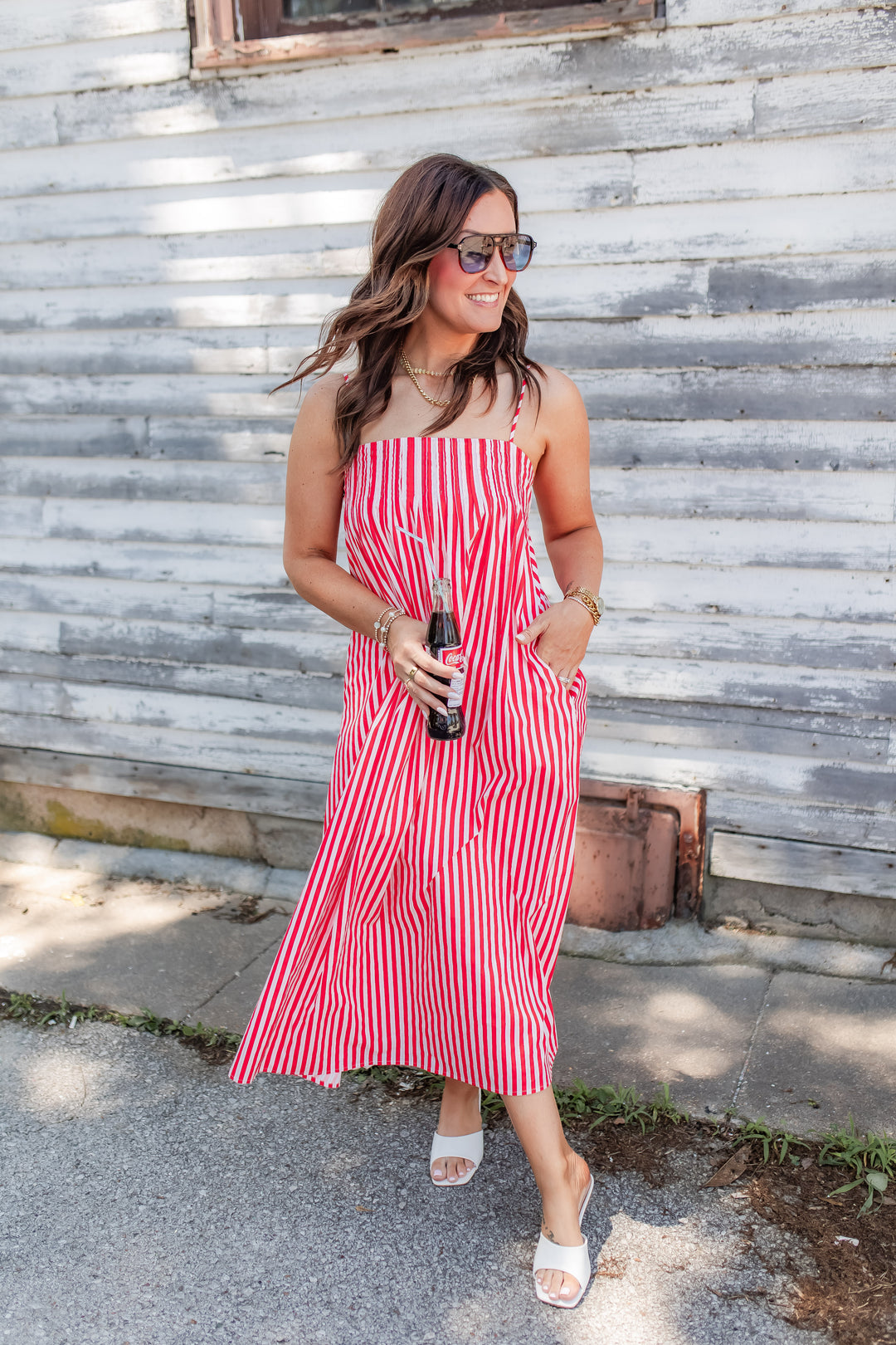 Red and white striped midi dress styled for summer with lightweight flowy fit