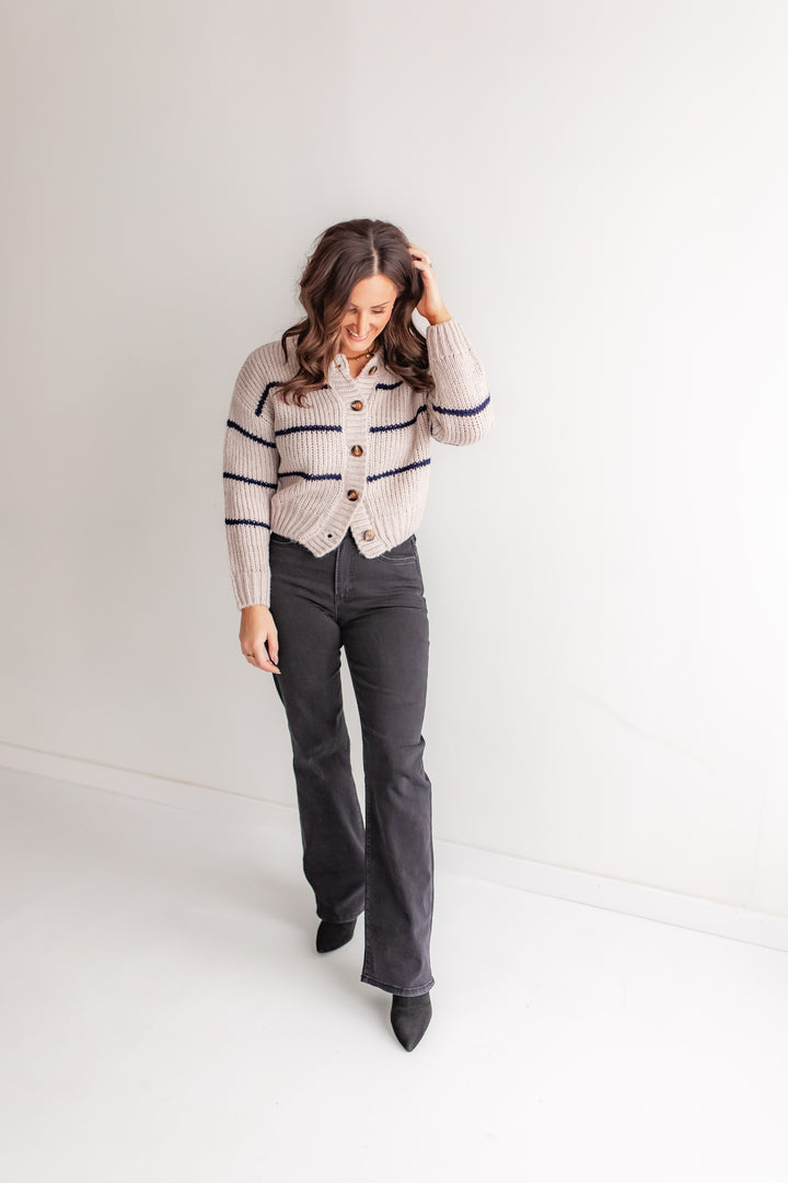 Women’s shell and navy striped cardigan outfit