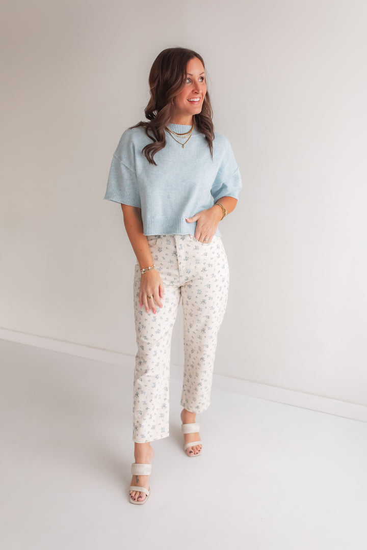 Floral barrel leg jeans styled with a lightweight sweater for a casual spring outfit