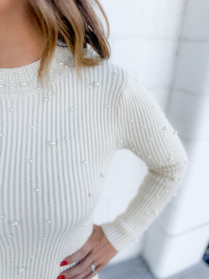 Chic winter outfit – cream pearl sweater dress