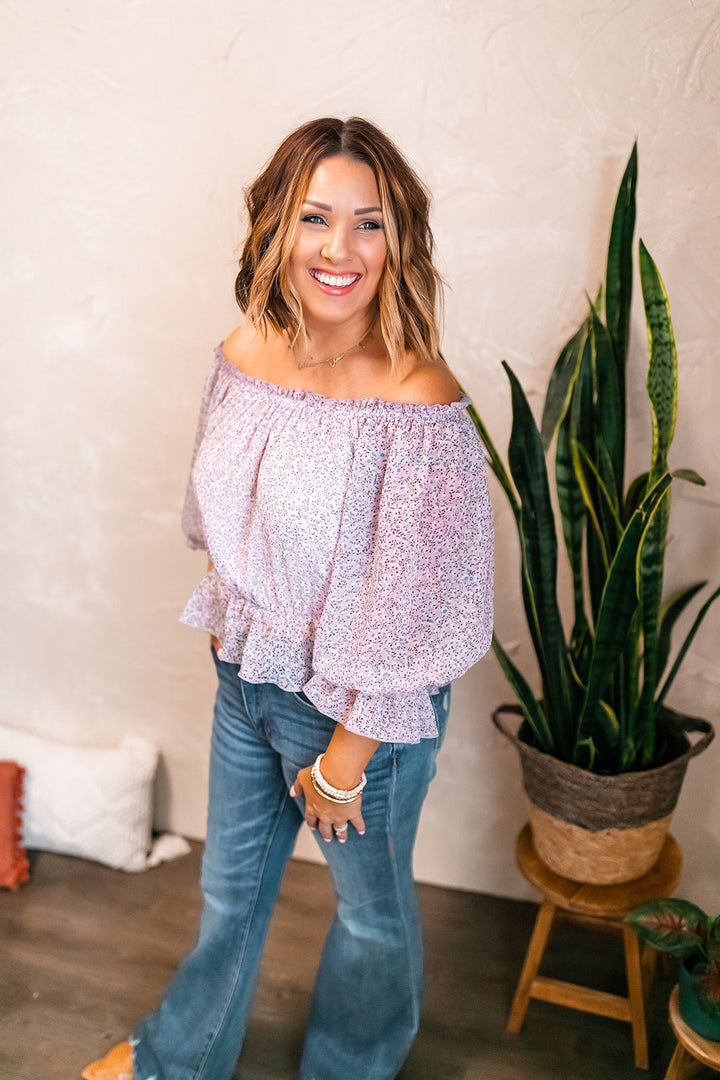 One Eleven Olive Boutique The Violet Floral Top This stunner is a must have! The Violet floral peplum top has a cinched waist, and the cutest balloon sleeve detail with cinched wrists as well as a ruffle detail al